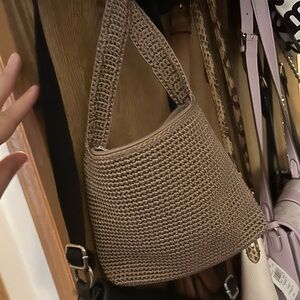 The SAK purse. Brand new,  ever used. Purchased from their store online.